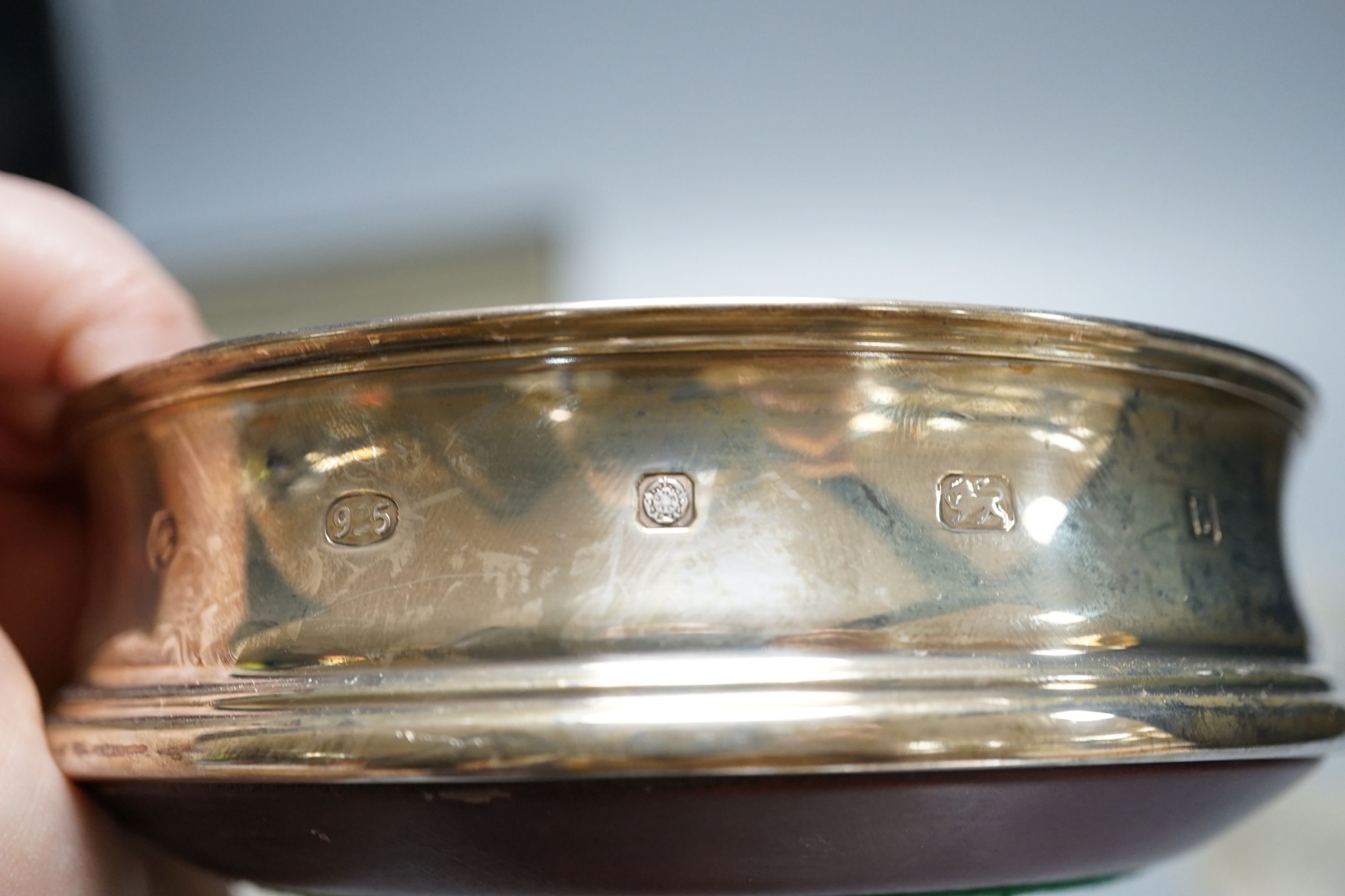 A cased set of six German 800 standard teaspoons by Robbe & Berking, a set of six silver mounted glass coaster and a modern silver mounted wine coaster.